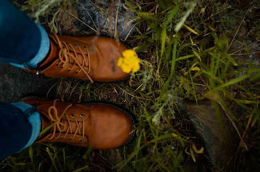 Self-portrait of a persons feet in nature.