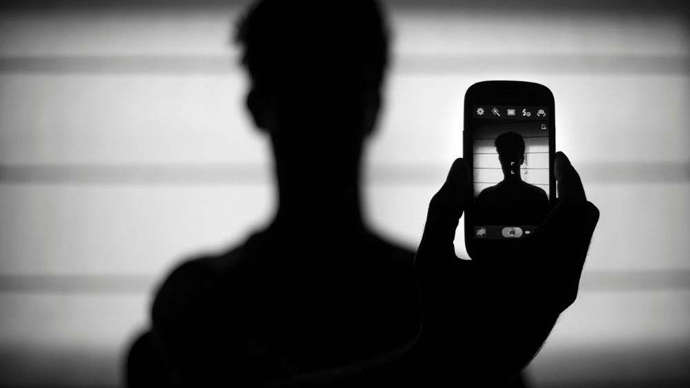 A creative self-portrait using the camera in a mobile phone.