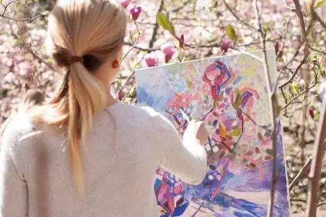 Woman painting: How You Can Overcome Art Blocks