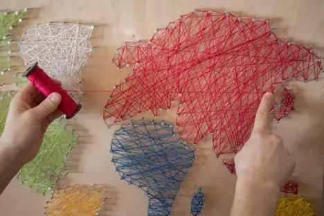 Person creating string art